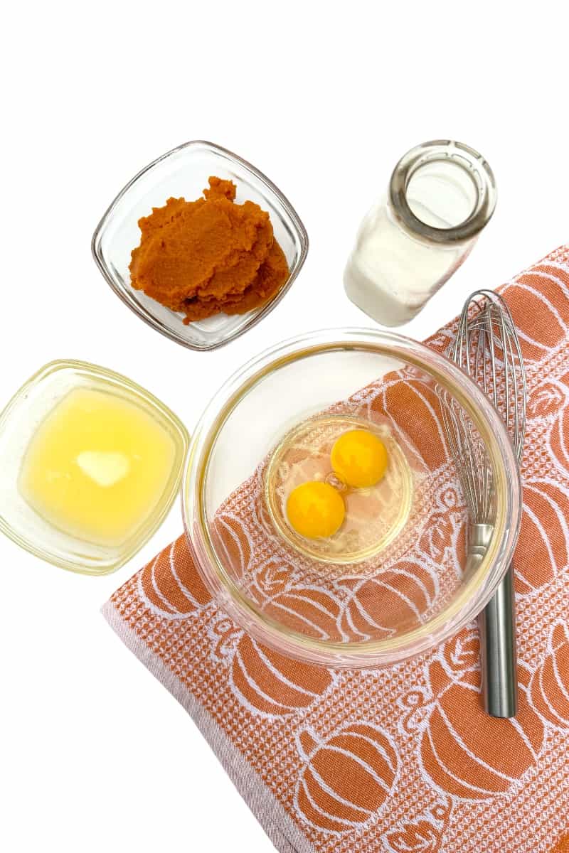 Whisk eggs, milk, pumpkin, and melted butter.