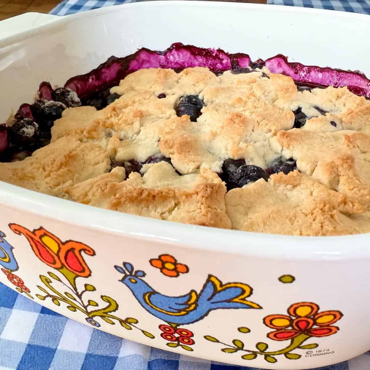 Bisquic Blueberry Cobbler in a vintage Corning Dish.