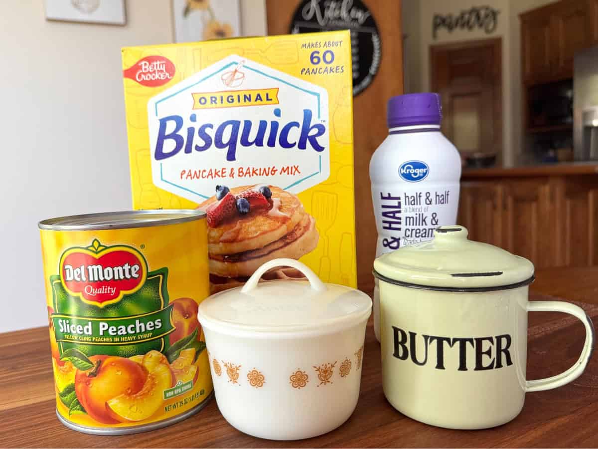 Can peaches, Bisquick, Sugar jar, bottle of half and half, and butter tin.