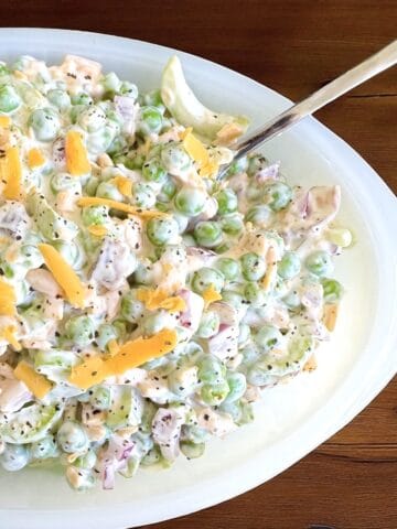 Bowl of Green Pea Salad with a spoon.