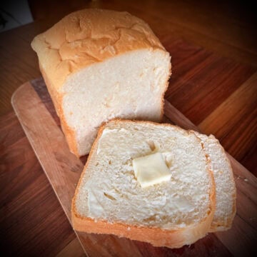 Sliced White bread on a board.