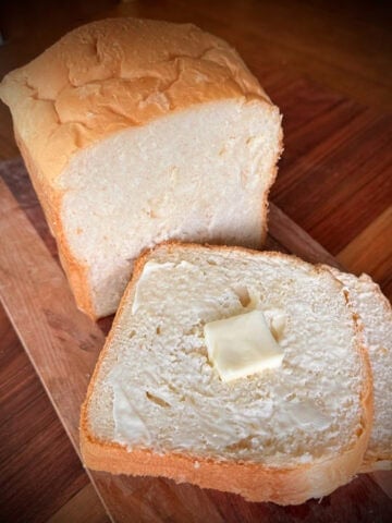Sliced White bread on a board.