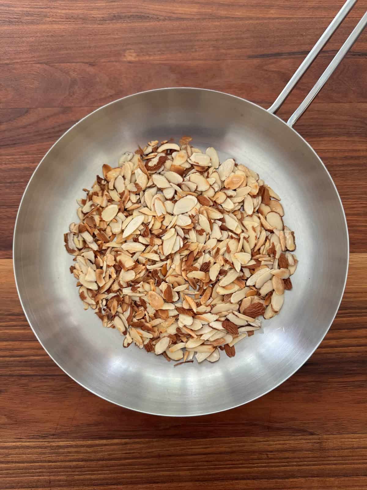 Toasting almonds in a skillet.