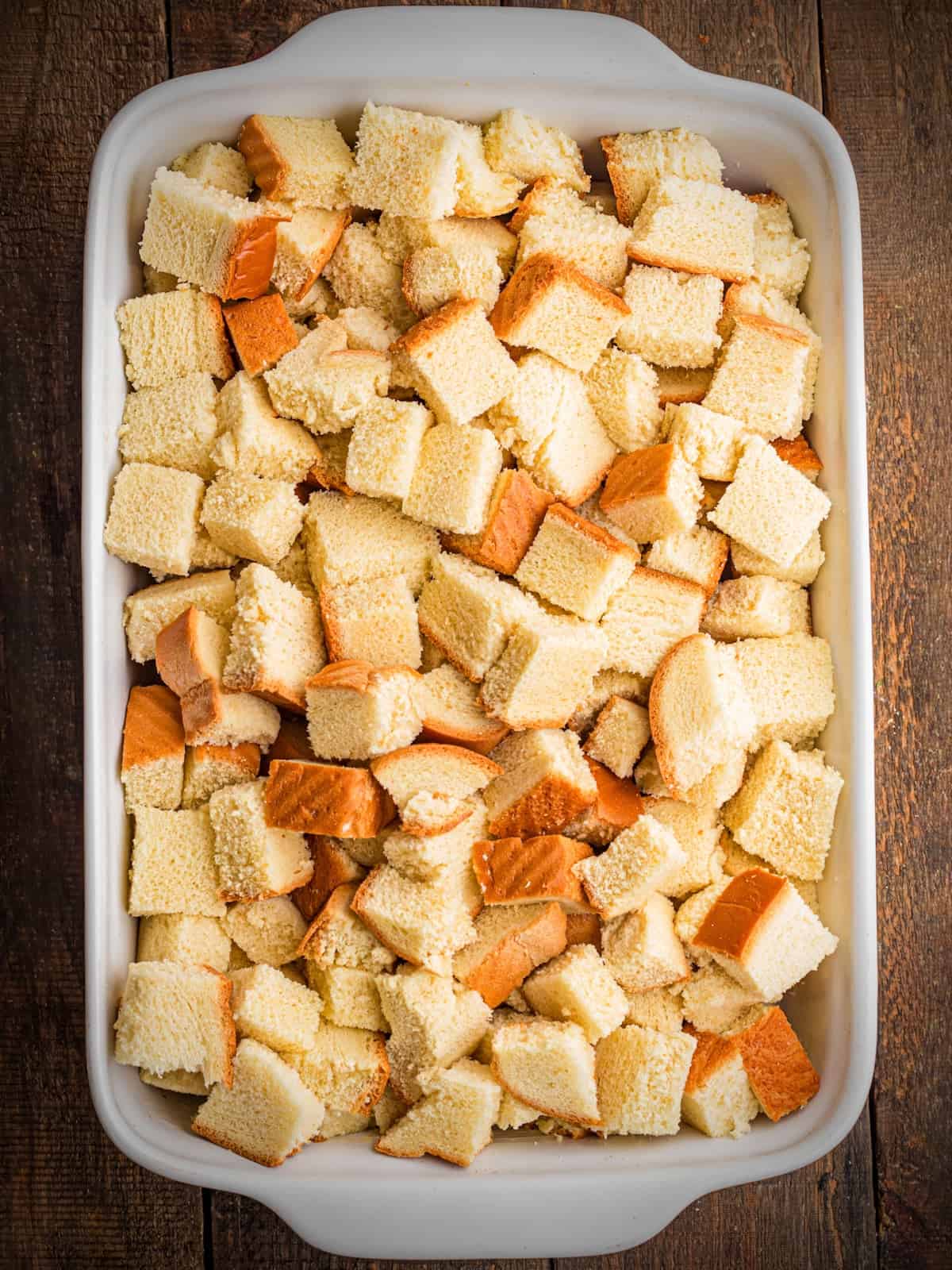 Bread cubes in pan.