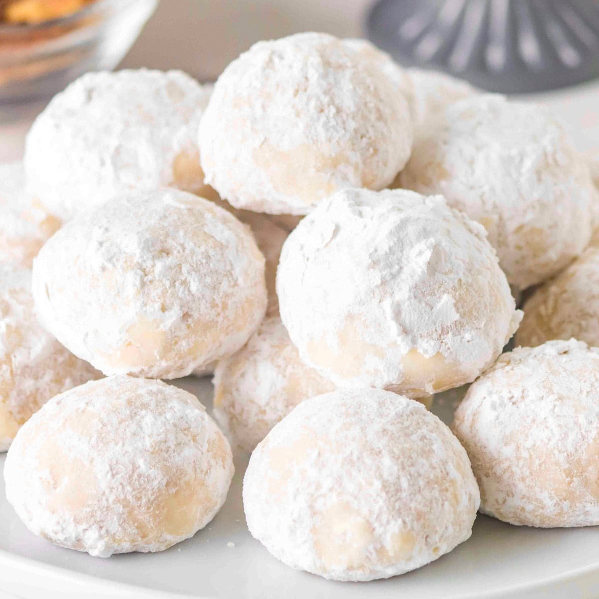 Plate of white cookies called snowballs.