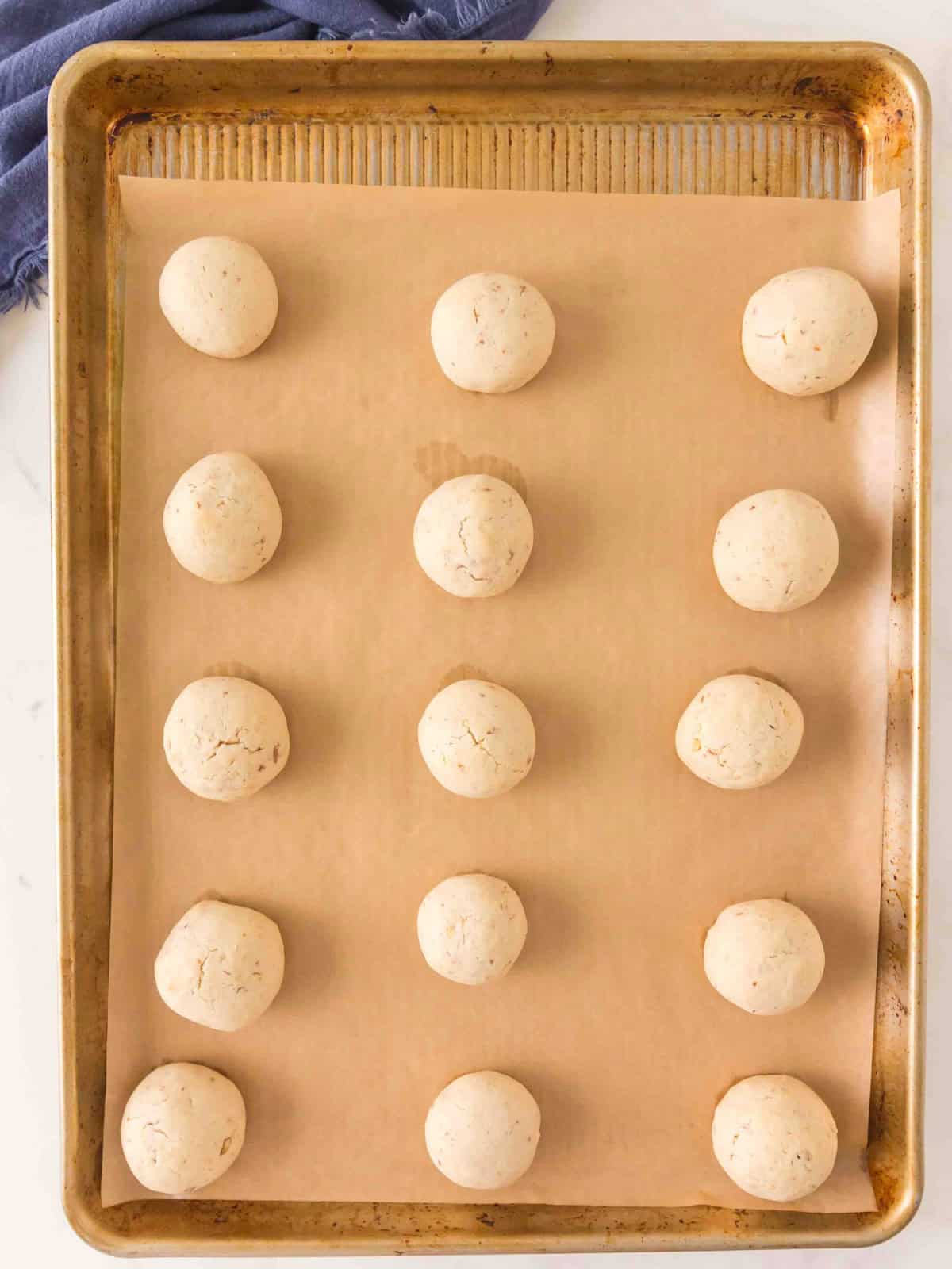 Dough balls on baking sheet.
