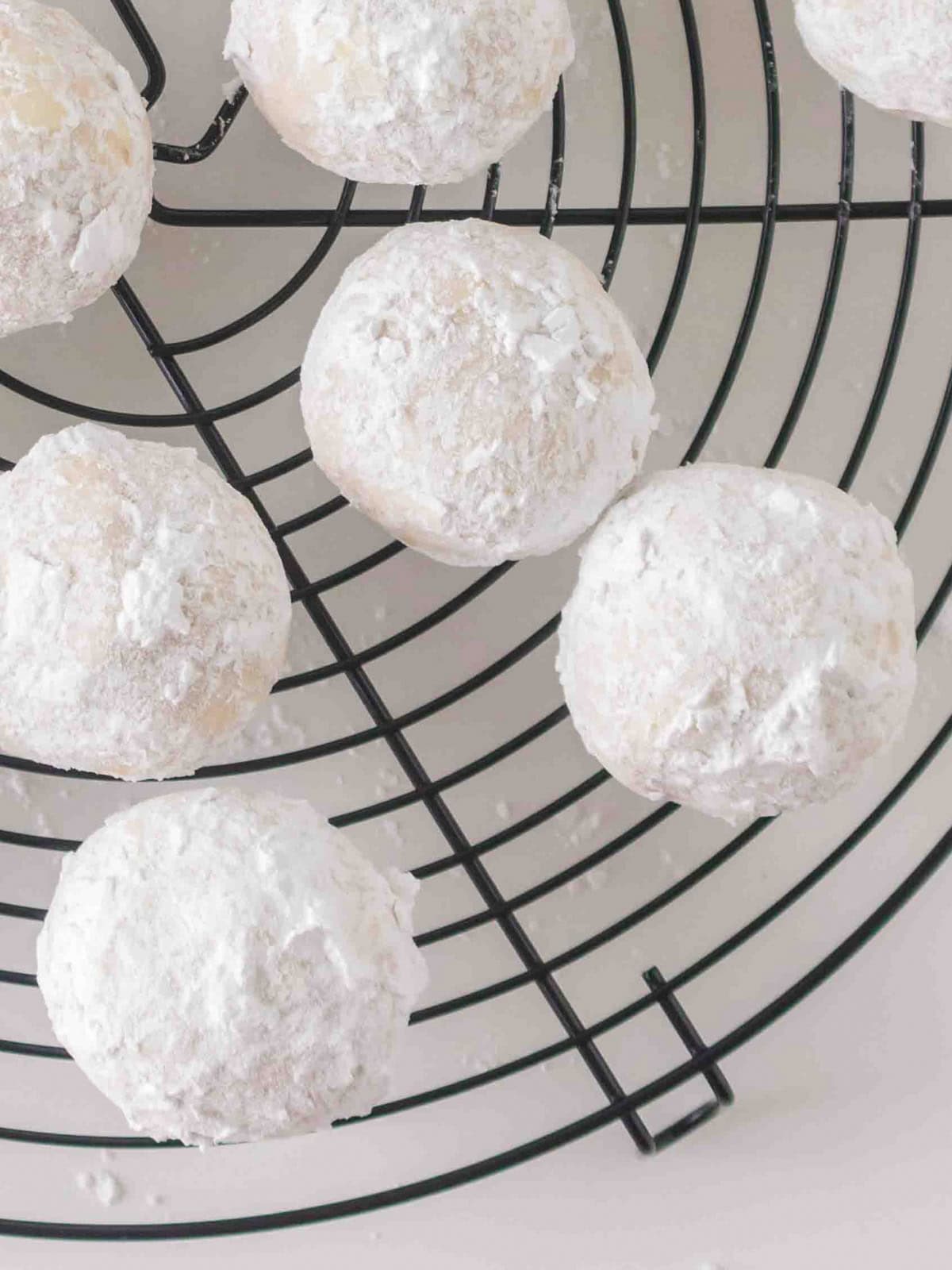 White cookies cooling on rack.